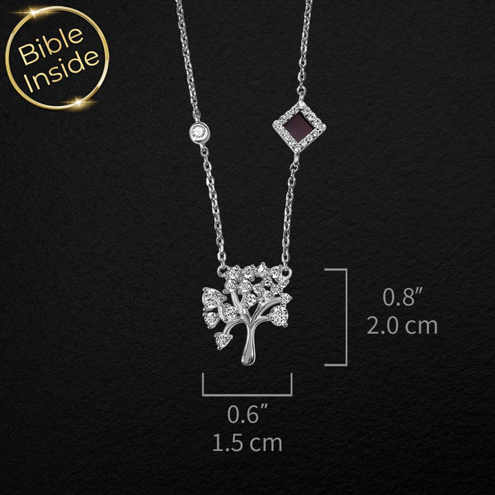 Silver biblical necklace with tree of life and miniature Bible inside
