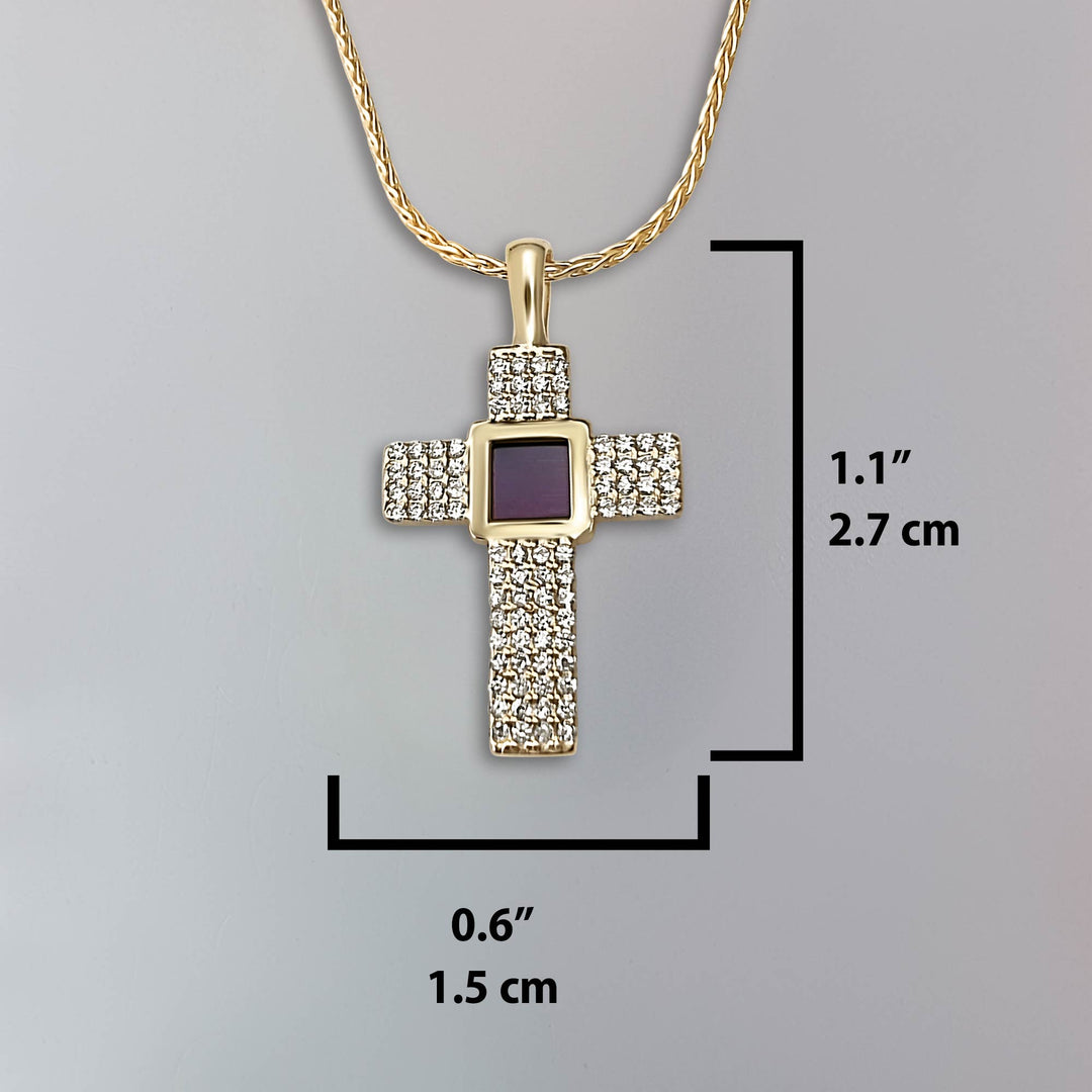 Christian cross necklace in gold featuring miniature Bible