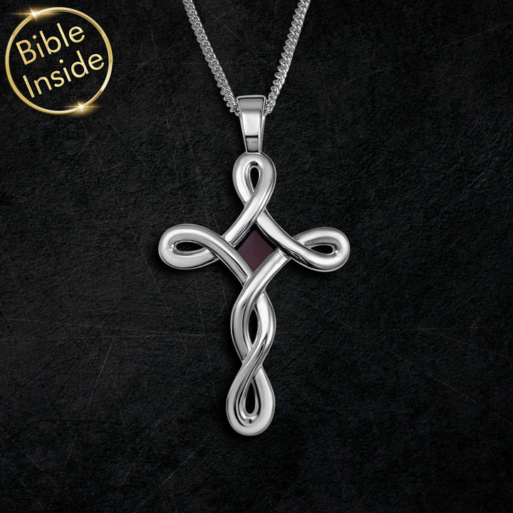 Simple cross white gold necklace featuring a miniature Bible chip inside