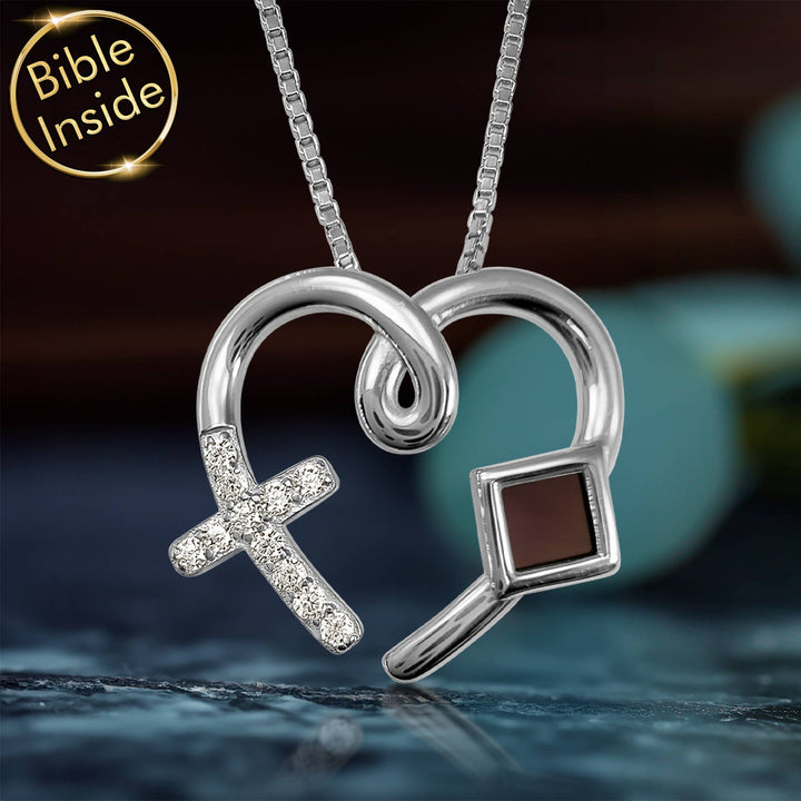 Dainty silver heart necklace for women, holding the New Testament close